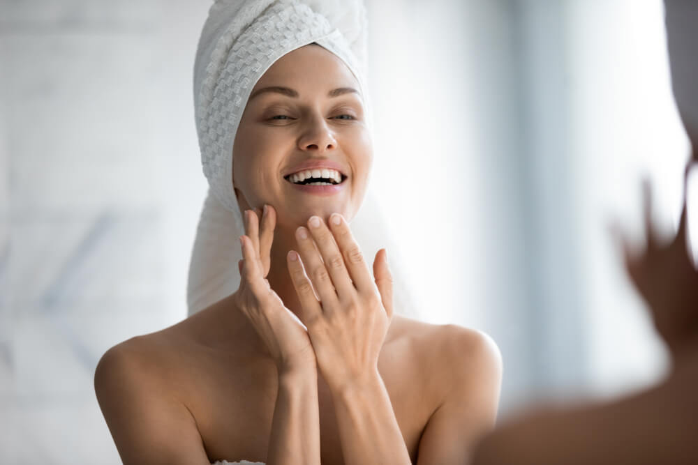 Woman applying face cream