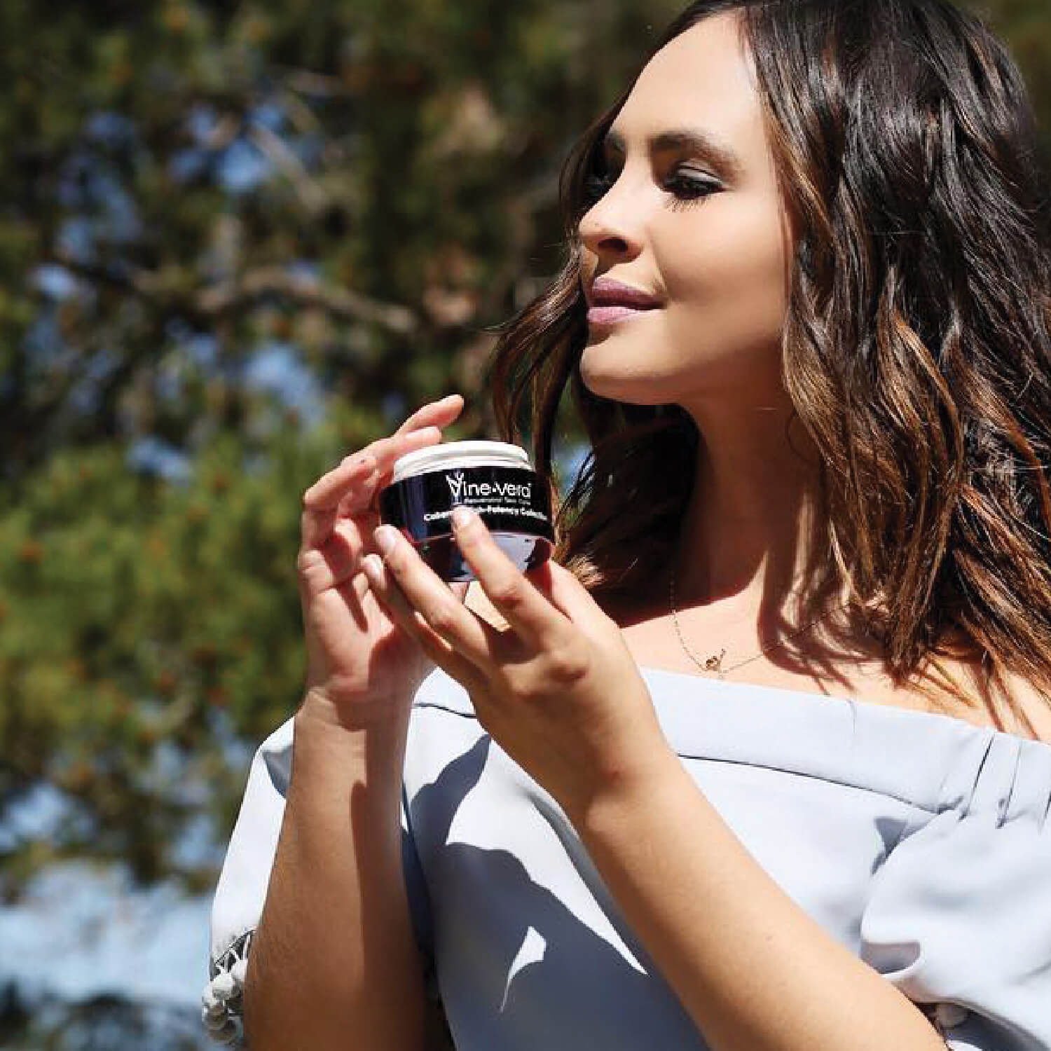 Woman holding Cabernet Collection cream