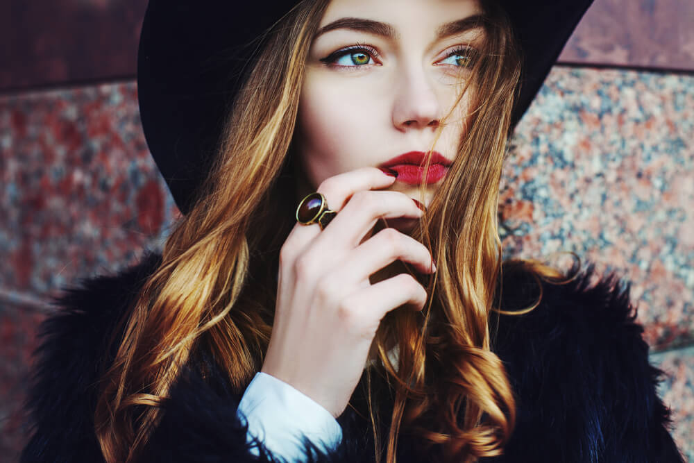 Beautiful fashionable woman in hat