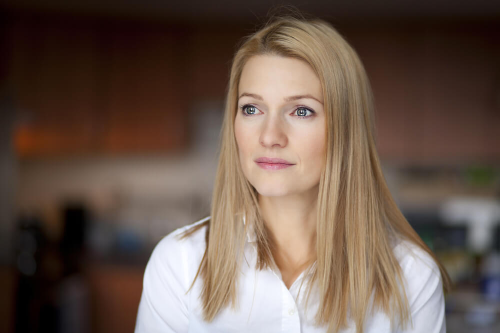 Pensive middle-age blonde woman