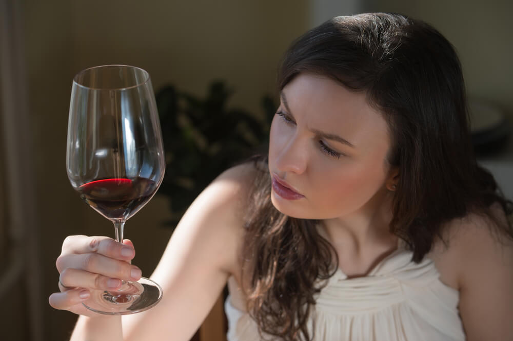 Woman drinking red wine