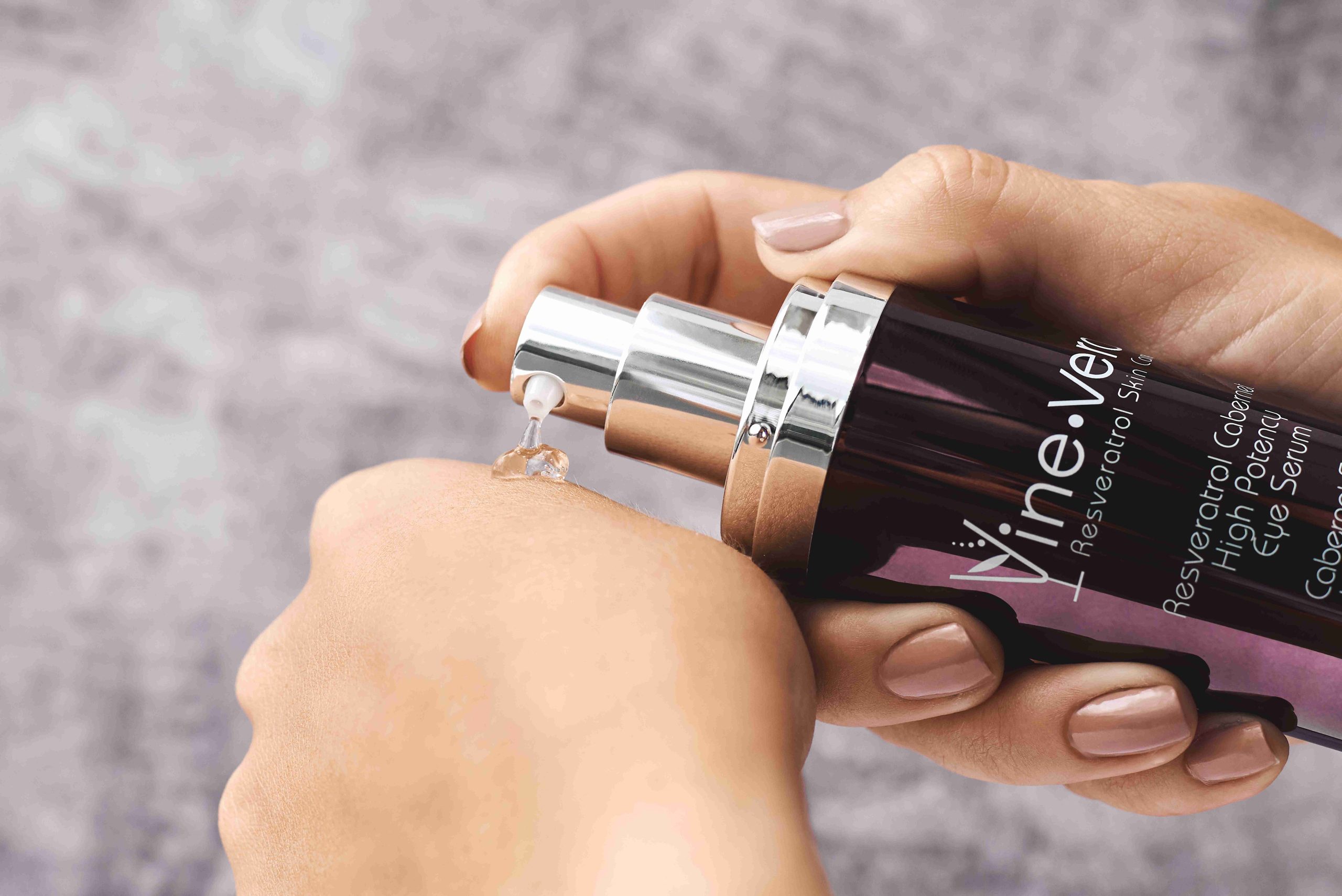 Hand using the Vine Vera eye serum