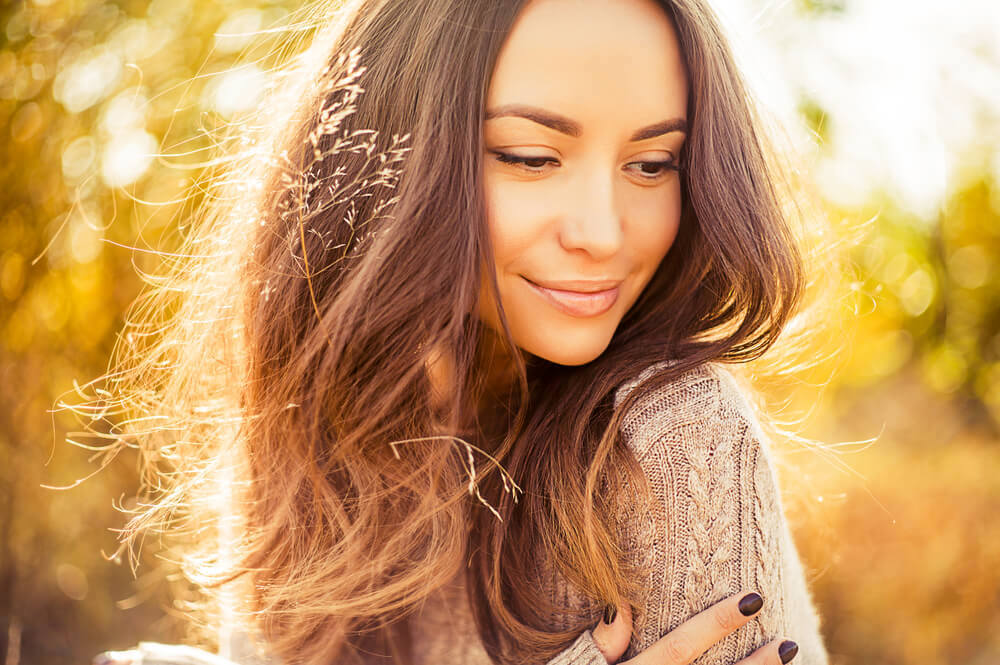 Beautiful woman outdoors during the fall season