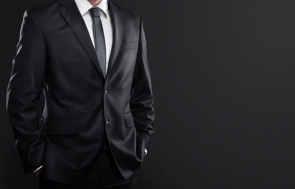 Unknown man in a black suit