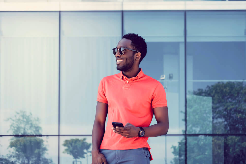 Fashionable man enjoying the summer sun outdoors