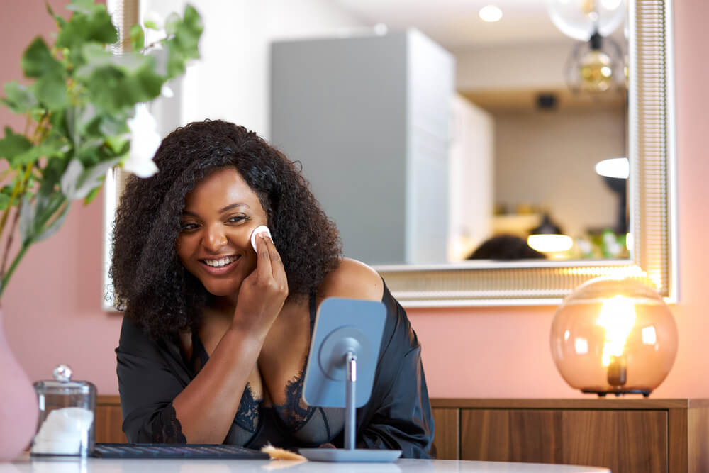 Woman applying skin product