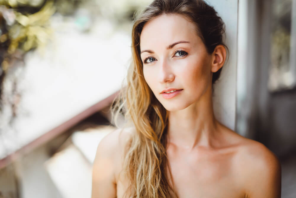 Pensive beautiful woman on the patio