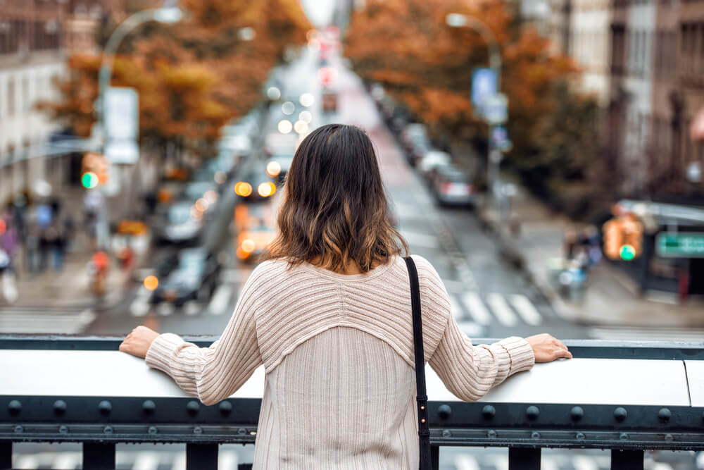 Woman looking at city