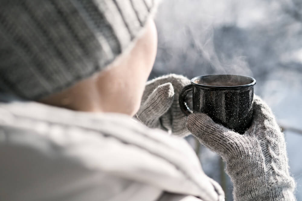Woman drinking tea in winter