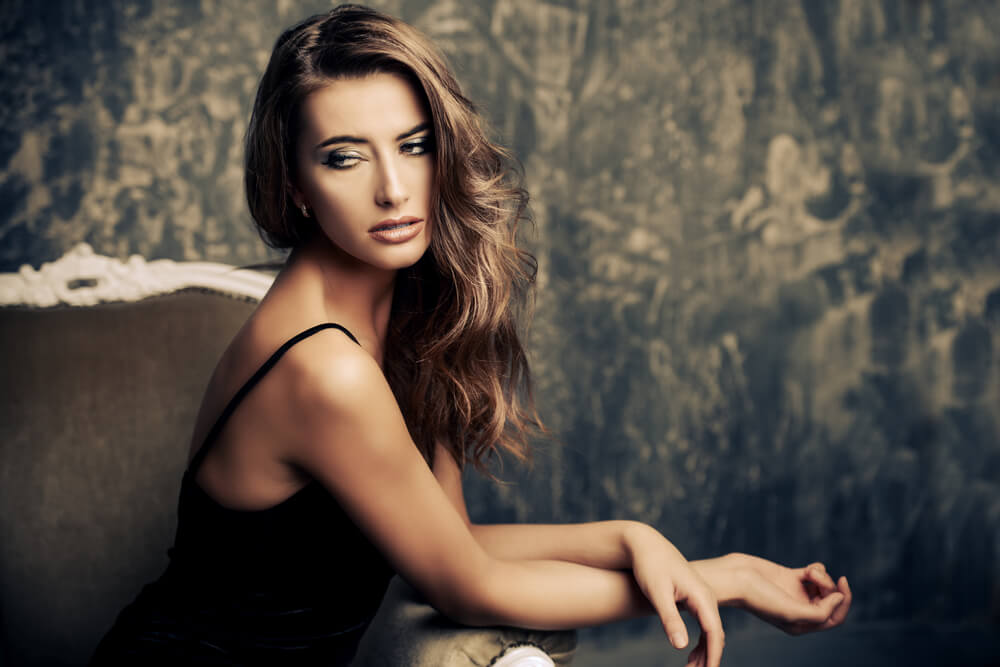 Beautiful woman looking tired, sitting down