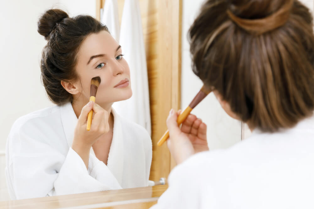 Woman applying foundation