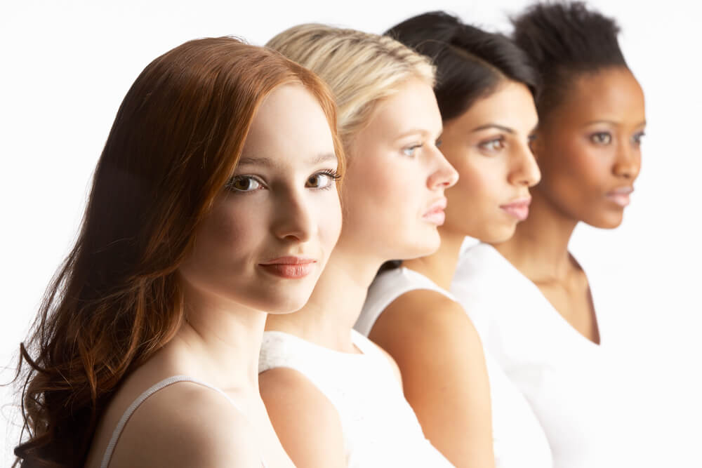 Multi-ethnic women lined up in a row