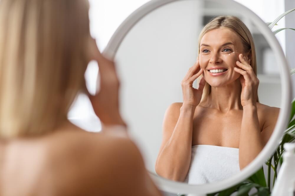 woman smiling in mirror