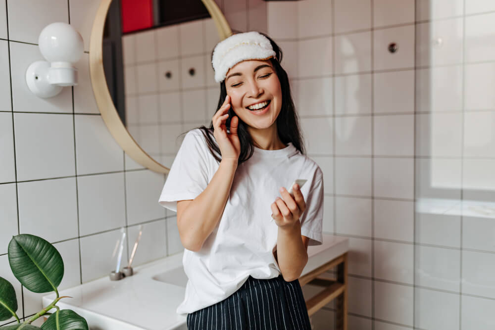 girl in bathroom smiling